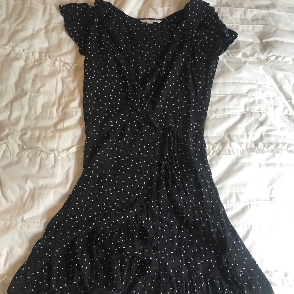 Adorable black dress with small white polka dots